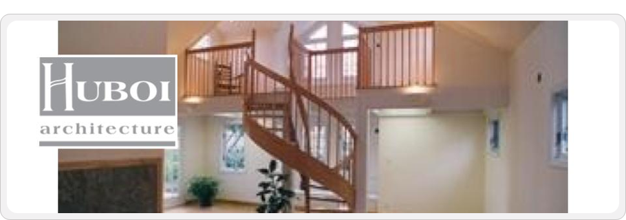 Photo of a stairwell in a home leading from a loft to a lower floor.